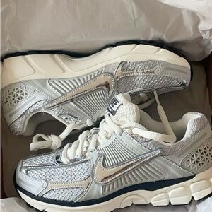 Nike Women's Metallic Silver and White Sneakers